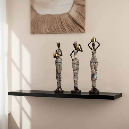 Three African figurines in luxury interior